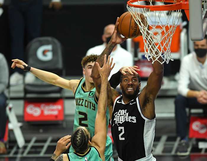 Mar 20, 2021; Los Angeles, California, USA; Los Angeles Clippers forward Kawhi Leonard (2) is fouled by Charlotte Hornets guard LaMelo Ball (2) as he goes up for a dunk in the second half of the game at Staples Center. Mandatory Credit: Jayne Kamin-Oncea-USA TODAY Sports